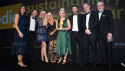 Compere Julia Bradbury (left) and Harvey Laud of Reconomy (right) presenting the Marston's team with the award